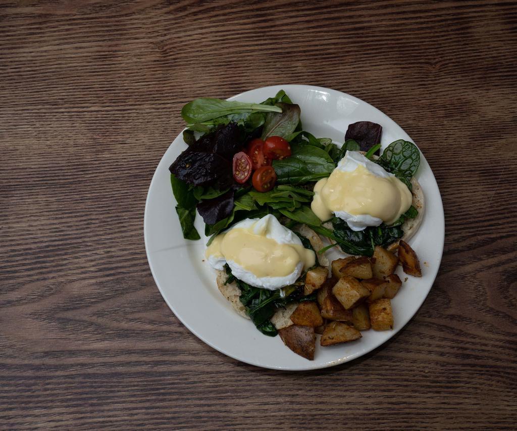 Eggs Benedict with Spinach · 2 poached eggs, sauteed spinach, and hollandaise sauce. Served on an English muffin with home fries and gossip salad.