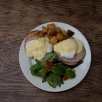 Smoked Turkey Eggs Benedict · 2 poached eggs, smoked turkey, and holladaise sauce. Served on an English muffin with home f...