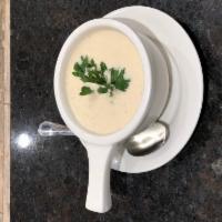 New England Clam Chowder · Sweet cream and clam broth, loaded with chunks of clams, potatoes and spice.