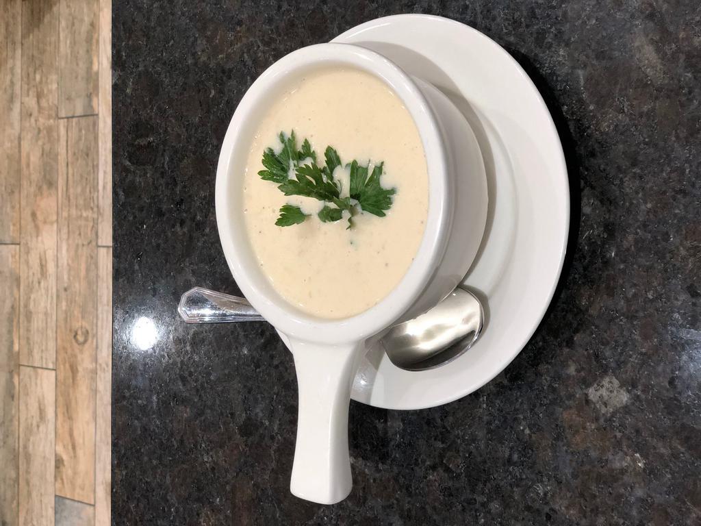 New England Clam Chowder · Sweet cream and clam broth, loaded with chunks of clams, potatoes and spice.