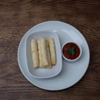 Cheese Roll · Filo dough stuffed with feta cheese and parsley. Served with Marinara sauce.