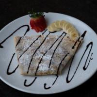 Gossip Crepe · Strawberry, banana, Nutella, and powdered sugar with chocolate drizzling