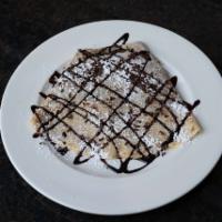 Chocolate Lover Crepe · Nutella, chocolate sprinkles and chocolate crunch, powdered sugar and chocolate drizzling