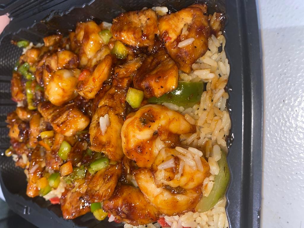Spicy Asian Chicken and Shrimp Bowl · Spicy Asian chicken and shrimp with fried rice and veggies.