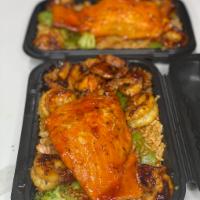 COMBO Spicy  Asian Chicken and Shrimp and Honey Glazed Salmon Bowl · Spicy Asian chicken and shrimp with honey glazed salmon fried rice and veggies.