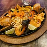 Picadera de Mariscos · Mixed seafood platter with camarones (shrimp) , calamari , and langosta (lobster).tostones