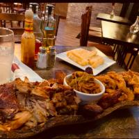 Tour of Havana Combination Platter · Pernil (roast pork), ropa vieja (braised beef) & chicharrones de pollo (fried chicken).