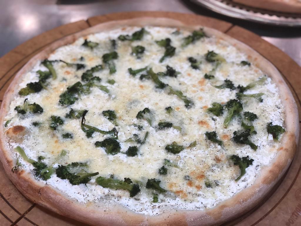 Large White Spinach Pizza · Ricotta base topped with spinach, mozzarella and Romano cheeses.
