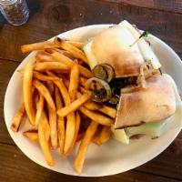 Philly Cheese Steak · Sliced beef, sauteed mushrooms, onions and green peppers with Swiss cheese on a French roll.