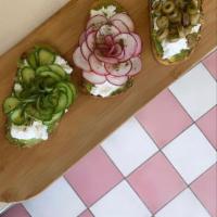 Avocado Lebneh Toast · Toasted sourdough 
Smashed Avocados 
Lebneh 
Sliced cucumbers 
Pickled radishes 
Chopped gre...