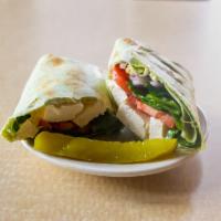 The 1872 Veggie Wrap · Spinach and tofu, lightly seasoned with garlic, olive oil and pepper mix blended with vegan ...