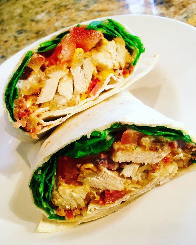 Landmark Buffalo Chicken Wrap · Boneless chicken with Buffalo sauce, bleu cheese dressing, spinach, tomato and banana peppers. Served best as a wrap.