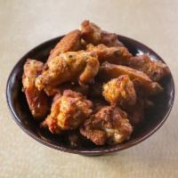 Traditional Crispy Bone in Wings (due to USA chicken shortage supplies may vary) · Select 5, 10, or 20 bone - in wings lightly spiced already & baked. Choose your sauce (n/c) ...