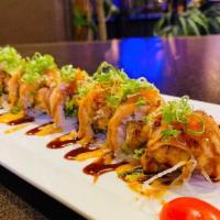 Crazy Salmon Roll  · Spicy salmon roll on top with seared salmon, spicy mayo and tobiko crunchy, eel sauce.