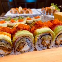 Goblin Roll · Soft shell crab, cucumber, masago roll with tuna, salmon, avocado and sweet sauce on top.