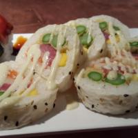 Maiko Roll · Tuna, salmon, hamachi, mango, tempura asparagus, wasabi aioli, on soy paper. 