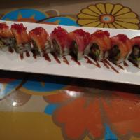 Geisha Roll · Deep fried panko battered oyster, avocado and jalapeno topped with salmon, tuna, eel sauce a...