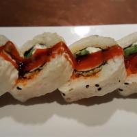 Tiger Eye Roll · Smoked salmon, cream cheese and jalapeno roll flash fried in seaweed paper then wrapped with...