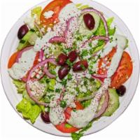 Greek Salad · Lettuce, cucumbers, tomatoes, onions, olives and feta cheese with Greek dressing.