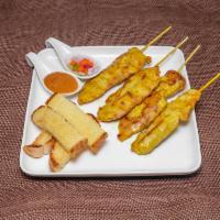 Satay  · 4 pieces. Grilled marinated meat of your choice. Serve with peanut and cucumber sauce.