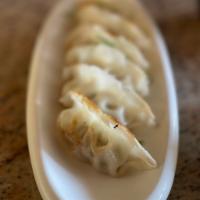 Gyoza  · 6 pieces. Dumpling stuffed with ground pork, chives, green onion, and cabbage. Serve with gi...