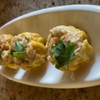 Shumai  · 4 pieces. Minced chicken and shrimp, sesame oil, scallion and carrot. Serve with ginger sauc...