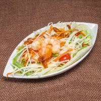 Papaya Salad · Spicy. Shredded fresh green papaya mixed with tomatoes, string bean in Thai spicy sauce and ...