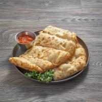 Breadsticks with Cheese · Served with our secret recipe pizza sauce and garlic butter sauce.