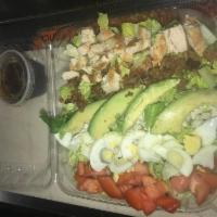 Cobb Salad · Romaine, grilled chicken, crumbled cheese, avocado, boiled egg, bacon, tomatoes and house vi...