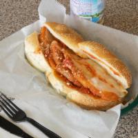Chicken Parmigiana Sandwich · Fresh all natural chicken breast with marinara sauce, blend of Parmesan and provolone. Serve...