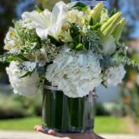 All Is Bright · All white arrangement, filled with white hydrangeas, white roses white lily Casablanca, and ...