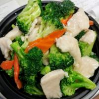 Chicken with Broccoli · Sliced chicken breast stir-fried with broccoli and carrots in a light garlic sauce. Served w...