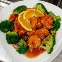 Orange Shrimp · Crunchy and juicy in a citrus flavor brown sauce on a bed of broccoli. Served with small whi...