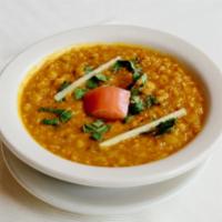 Masala Dal · Slightly spiced yellow lentils tempered with cumin seeds, red chilies, ginger and garlic. Se...