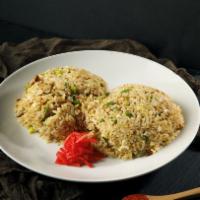 Chicken Fried Rice · Savory chicken wok-fried with egg, onion, and lightly seasoned with soy and sesame flavors.
