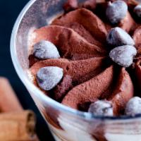 Tiramisu · Italian Dessert consisting of layers of sponge cake soaked in coffee, powdered chocolate and...