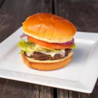 BT's Burger · Grilled Angus beef, cheddar cheese, signature sauce, lettuce, tomato and onion, on a warm pr...