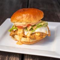 Spicy Crispy Chicken Sandwich · Spicy chicken breast, pepper jack cheese, jalapenos, signature sauce, lettuce, tomato on a w...