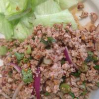 Larb Kai Salad · Ground chicken, mint leaves, green onion, shallots and roasted ground rice with spicy Thai d...