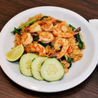 Thai Fried Rice · Stir-fried rice with egg, onion, tomato and Chinese broccoli in traditional Thai style.