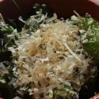 Shishito · Japanese peppers sauteed with soy sauce and topped with bonito flakes. Vegetarian.