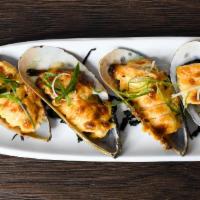 Baked Mussels · New Zealand green mussels on 1/2 shell baked with dynamite sauce.