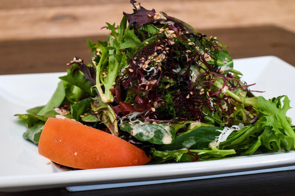 Wakame Salad · Organic baby greens with wakame seaweed tossed with creamy sesame dressing. Vegetarian.
