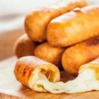 Tequenos (Pre cooked) Frozen Product · No, they are not mozzarella sticks; they are even better. These are cheese sticks made with ...