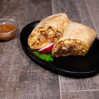 Breakfast Burrito · Breakfast burrito includes bacon, sausage, ham with hash browns, cheese and delicious red sa...