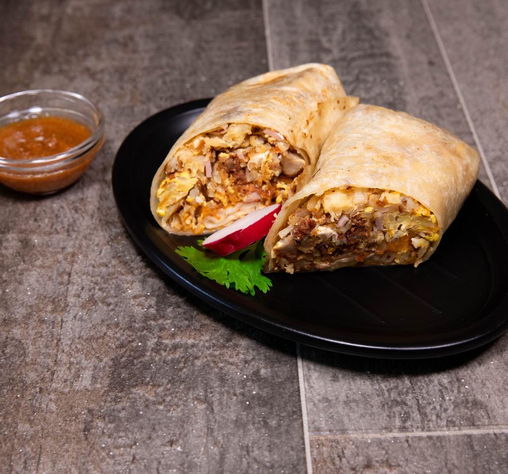 Breakfast Burrito · Breakfast burrito includes bacon, sausage, ham with hash browns, cheese and delicious red salsa.