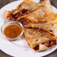 Pastrami Quesadilla · Grilled pastrami in a flour tortilla with a lot of cheese.