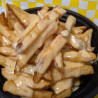 Cheese Fries · Freshly fried french fries with melted cheese atop.