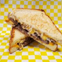 Grilled Cheese with Tri-Tip · Grilled cheese made with thick cut white bread with tri-tip in the middle.