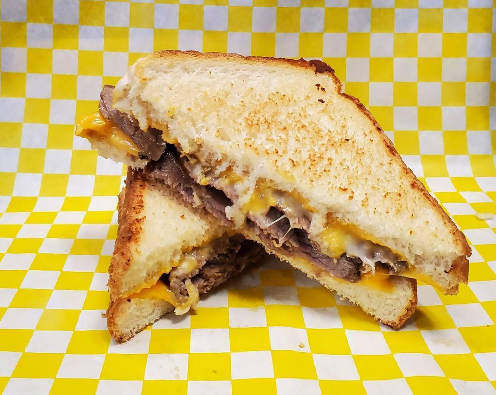 Grilled Cheese with Tri-Tip · Grilled cheese made with thick cut white bread with tri-tip in the middle.